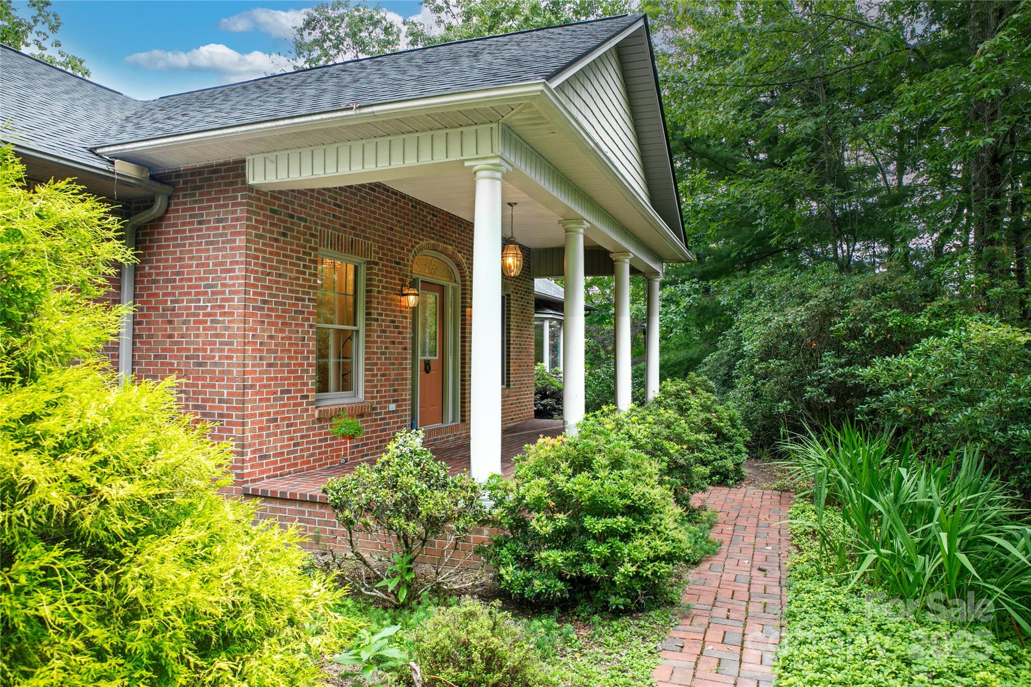 273 Inoli Circle Brevard, NC 28712 - Photo 2 of 47 a view of a small house with potted plants