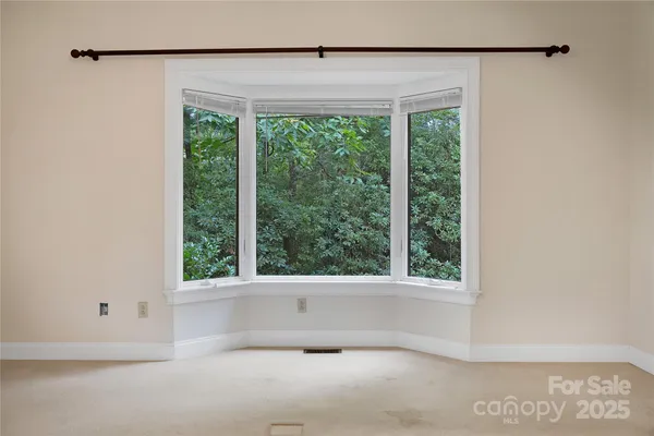 a view of a room that has a window in it