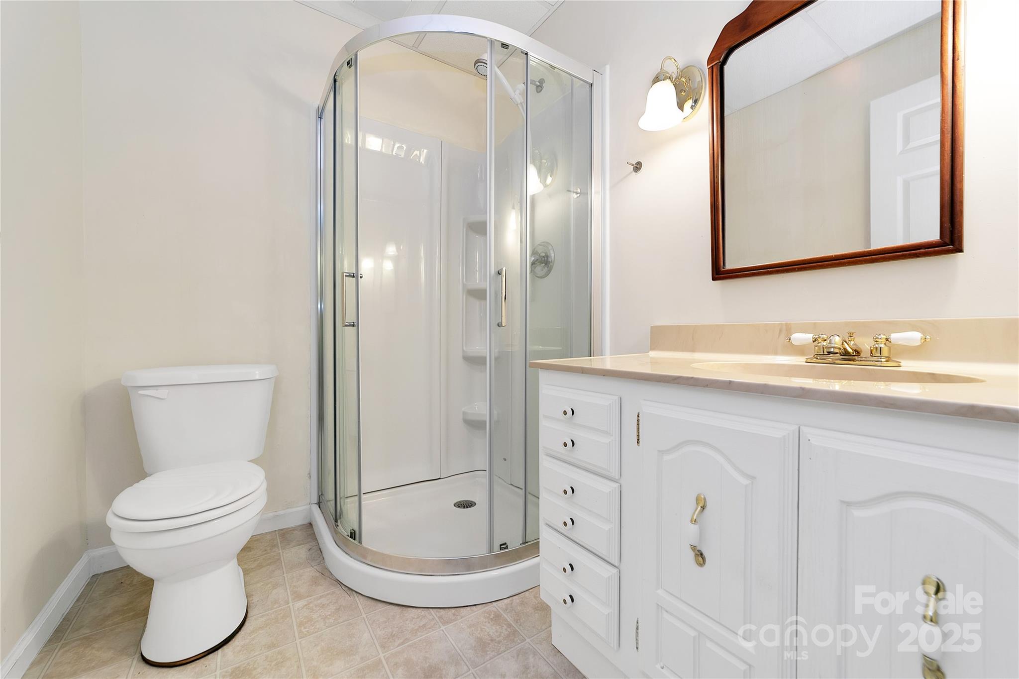 273 Inoli Circle Brevard, NC 28712 - Photo 43 of 47 a bathroom with a toilet sink and mirror