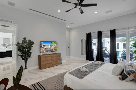 a view of walk in closet and bedroom
