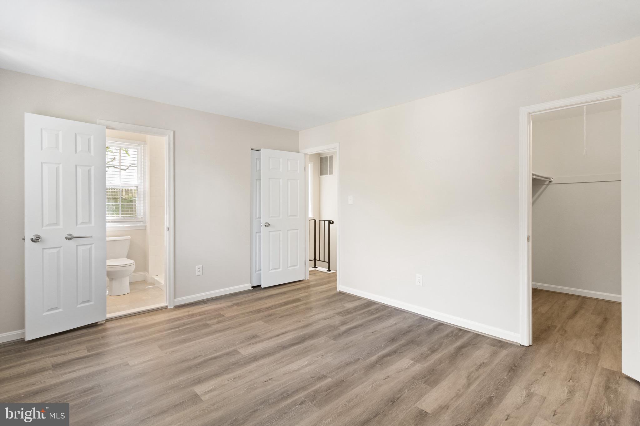 8581 Chester Grove Court Springfield, VA 22153 - Photo 22 of 38 an empty room with wooden floor