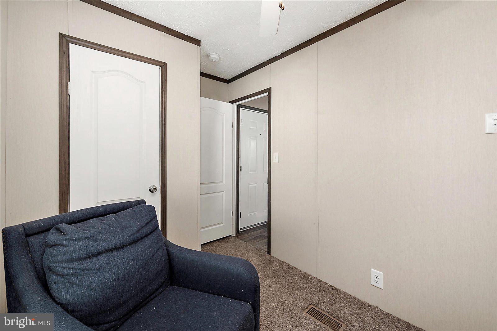 12346 Old Bridge Road, Unit 152 Ocean City, MD 21842 - Photo 30 of 55 a living room with furniture and a gate