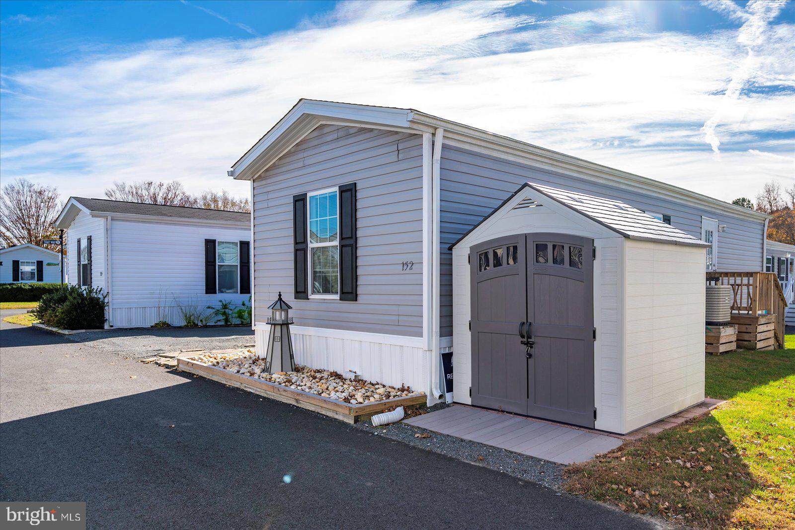 12346 Old Bridge Road, Unit 152 Ocean City, MD 21842 - Photo 3 of 55 a front view of house with yard