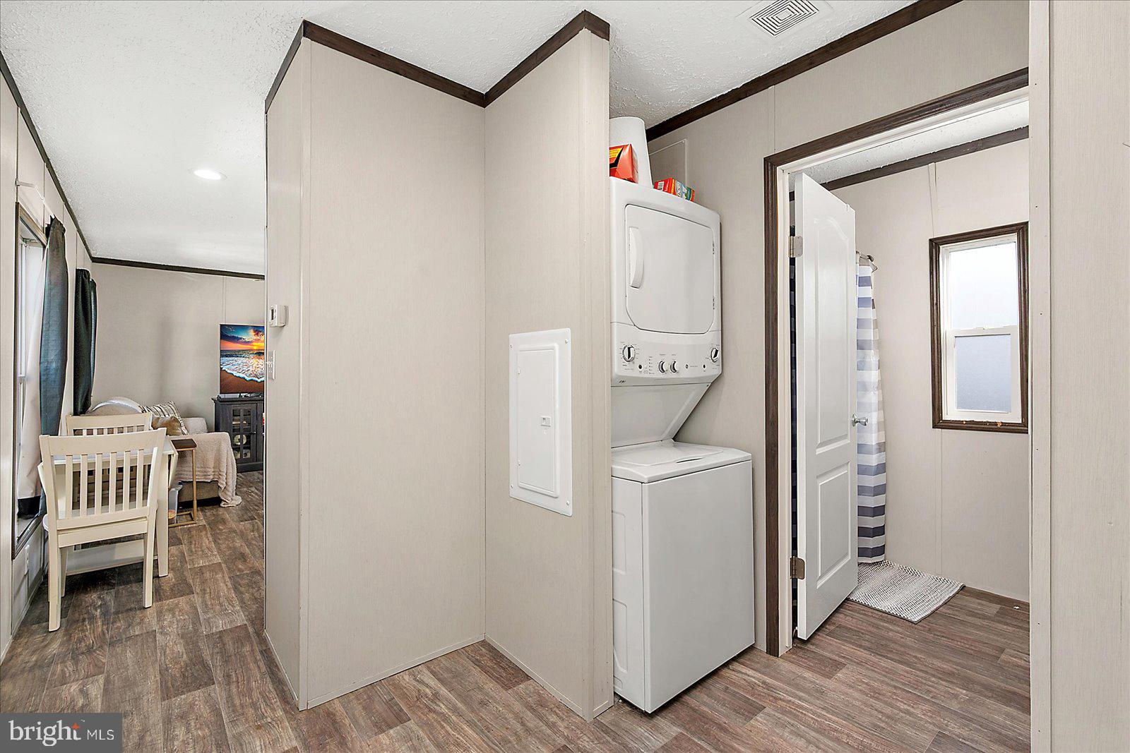 12346 Old Bridge Road, Unit 152 Ocean City, MD 21842 - Photo 31 of 55 a very nice looking room with wooden floor and a sink