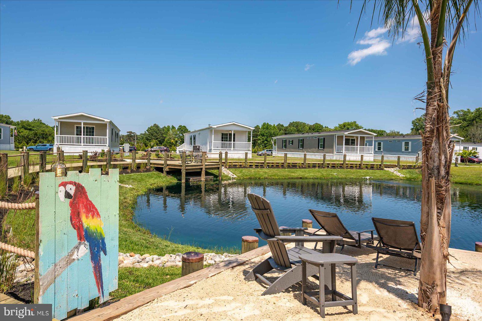 12346 Old Bridge Road, Unit 152 Ocean City, MD 21842 - Photo 36 of 55 a view of a lake with a house