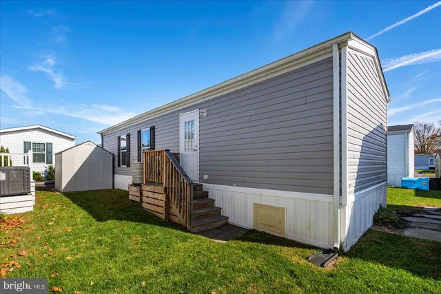 a view of backyard with a small cabin