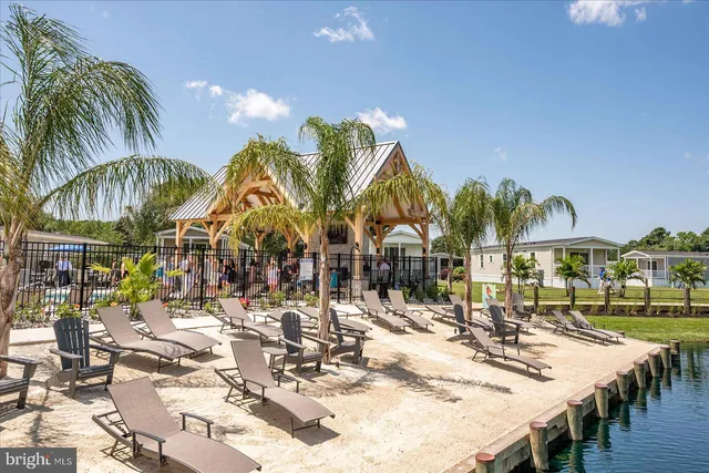 a view of a swimming pool with outdoor seating