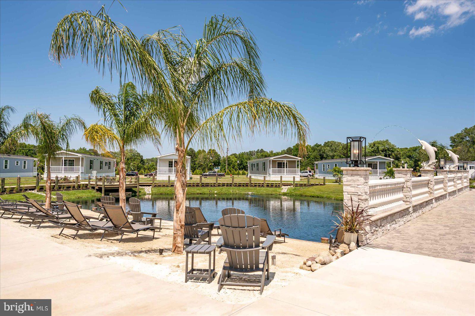 12346 Old Bridge Road, Unit 152 Ocean City, MD 21842 - Photo 51 of 55 a view of swimming pool with outdoor seating