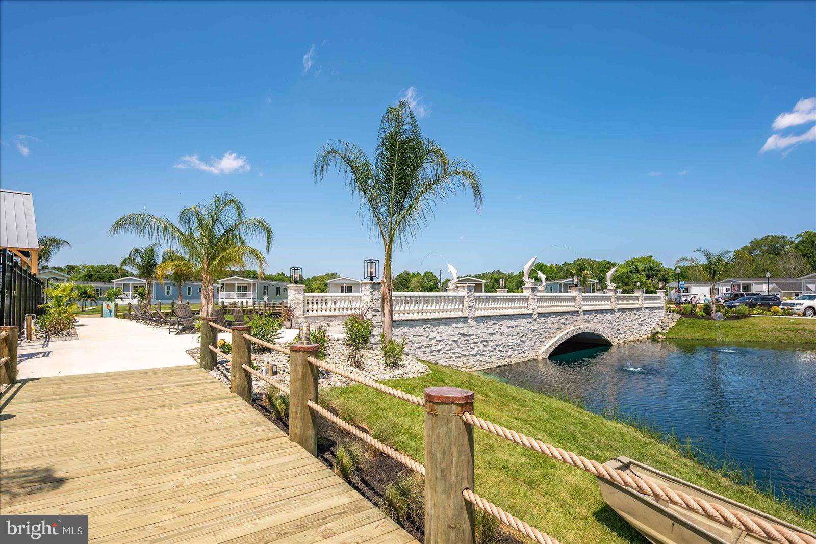 12346 Old Bridge Road, Unit 152 Ocean City, MD 21842 - Photo 54 of 55 a view of a swimming pool with outdoor seating