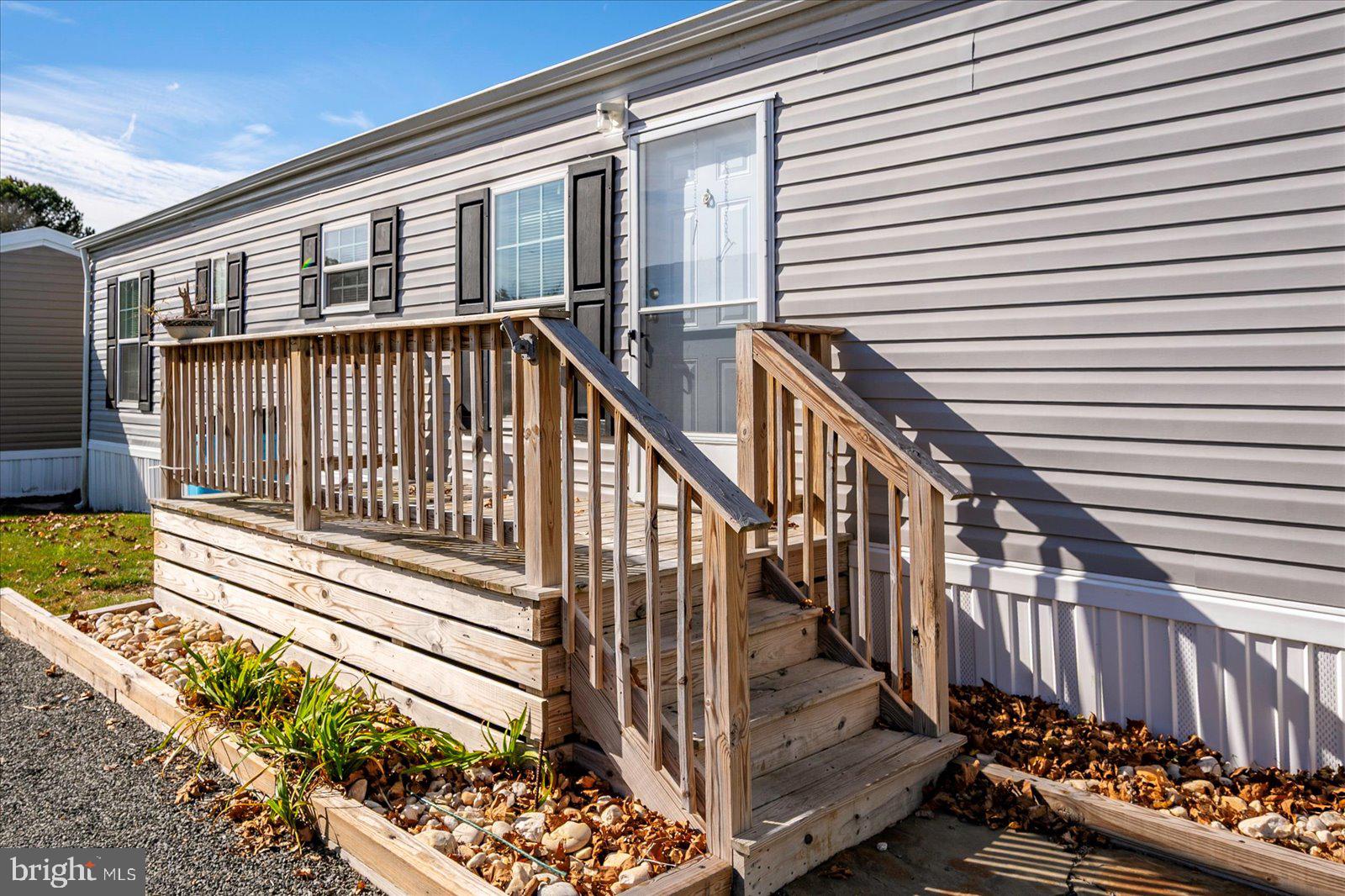 12346 Old Bridge Road, Unit 152 Ocean City, MD 21842 - Photo 6 of 55 a view of a house with wooden deck