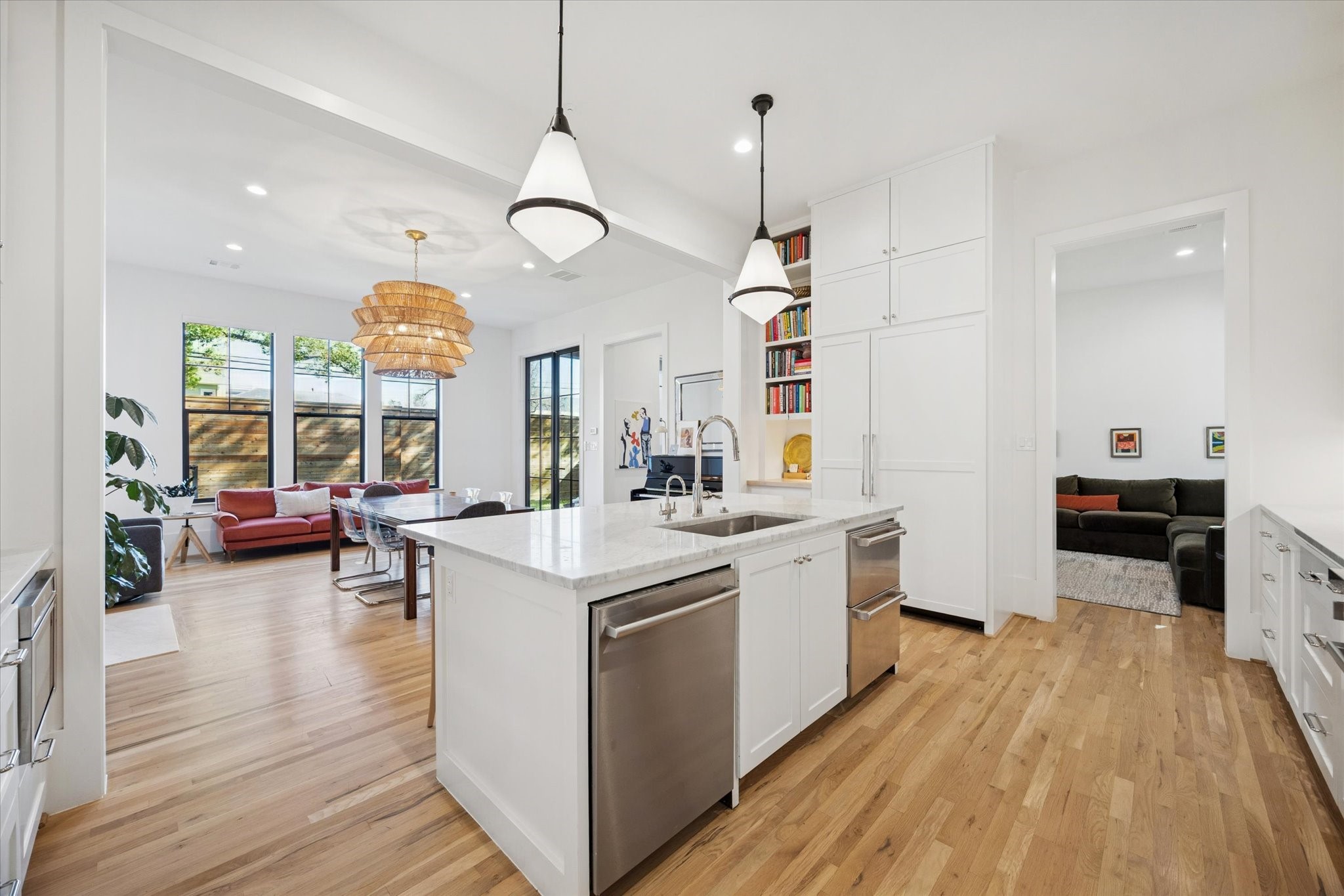 701 Ridge Street Houston, TX 77009 - Photo 20 of 50 a large kitchen with kitchen island a large island a sink stainless steel appliances and wooden floor