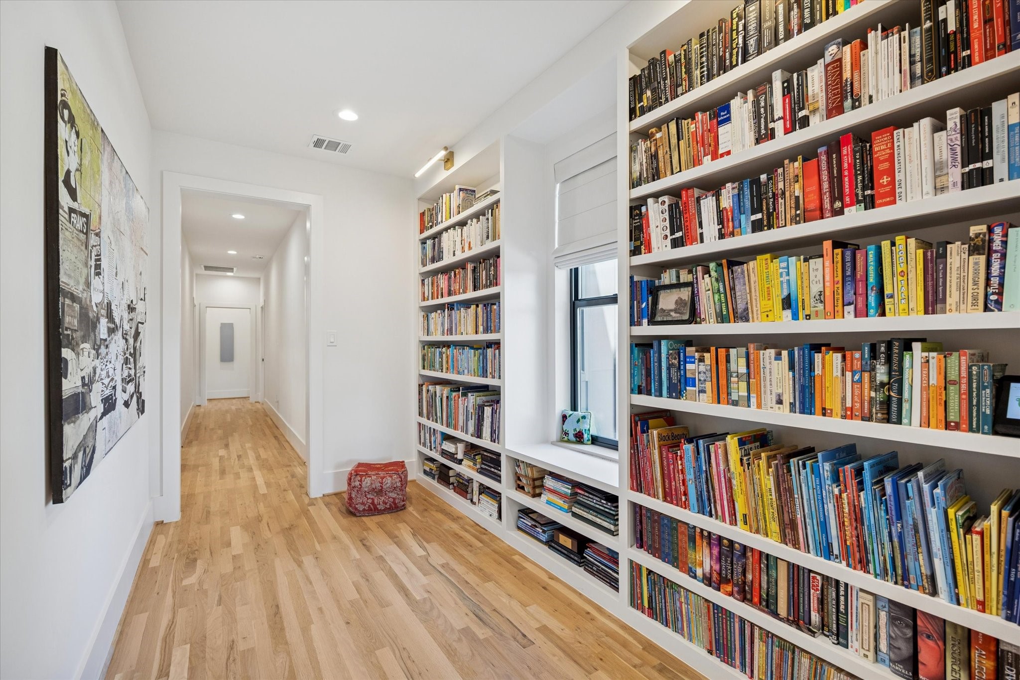 701 Ridge Street Houston, TX 77009 - Photo 25 of 50 a living room with lots of books