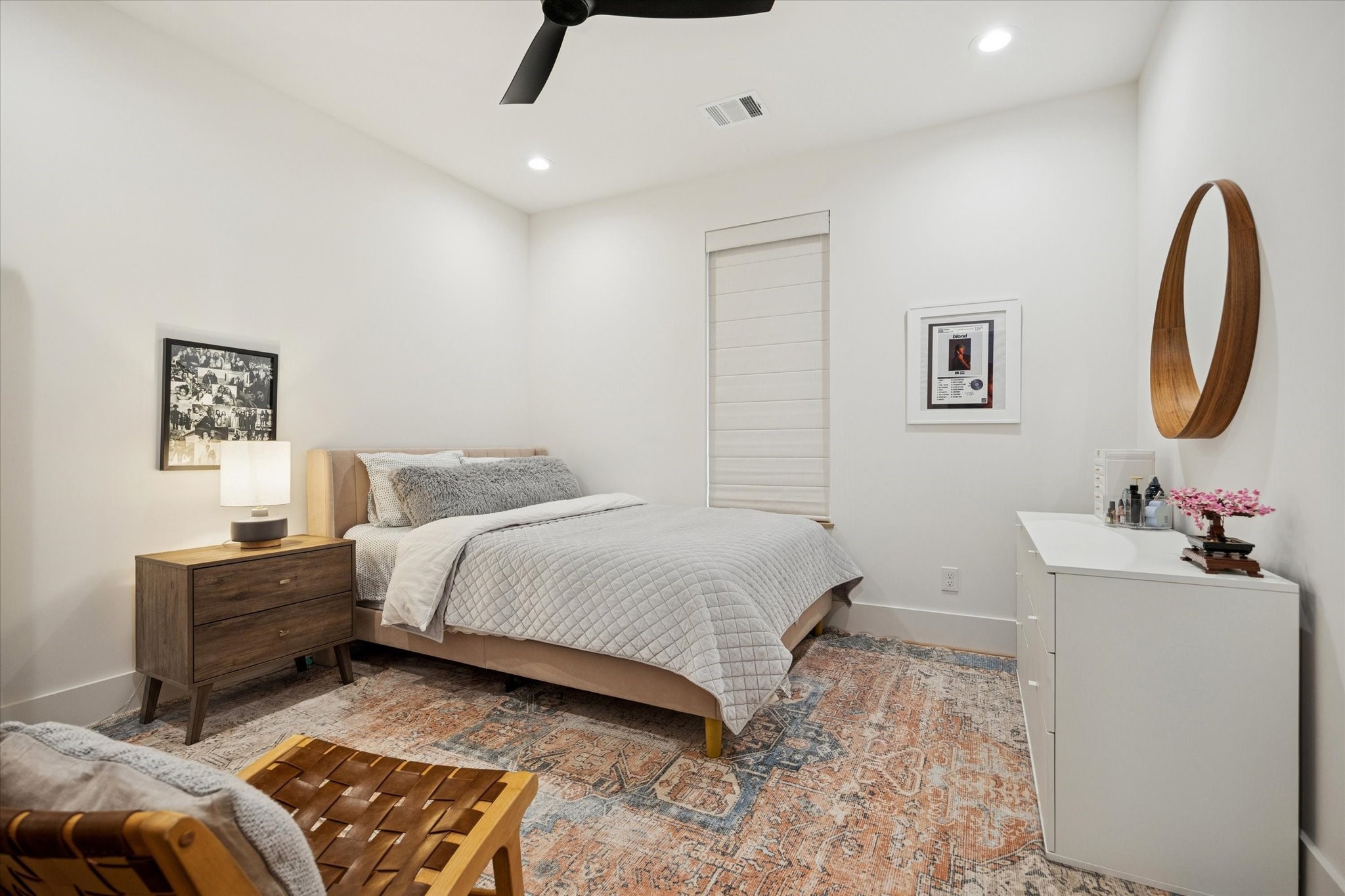 701 Ridge Street Houston, TX 77009 - Photo 26 of 50 a bedroom with a bed and a chandelier