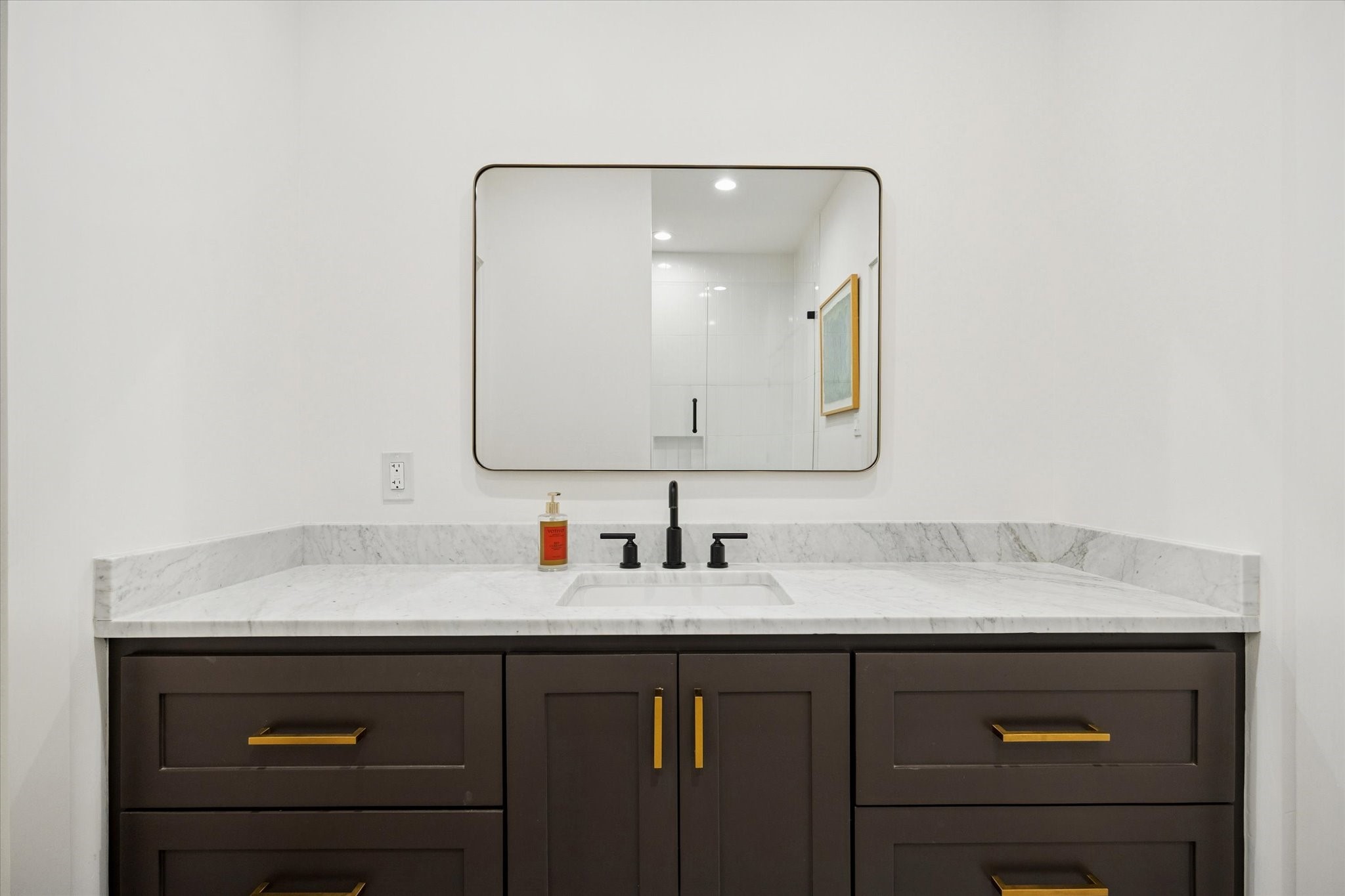 701 Ridge Street Houston, TX 77009 - Photo 30 of 50 a bathroom with a sink vanity and a mirror