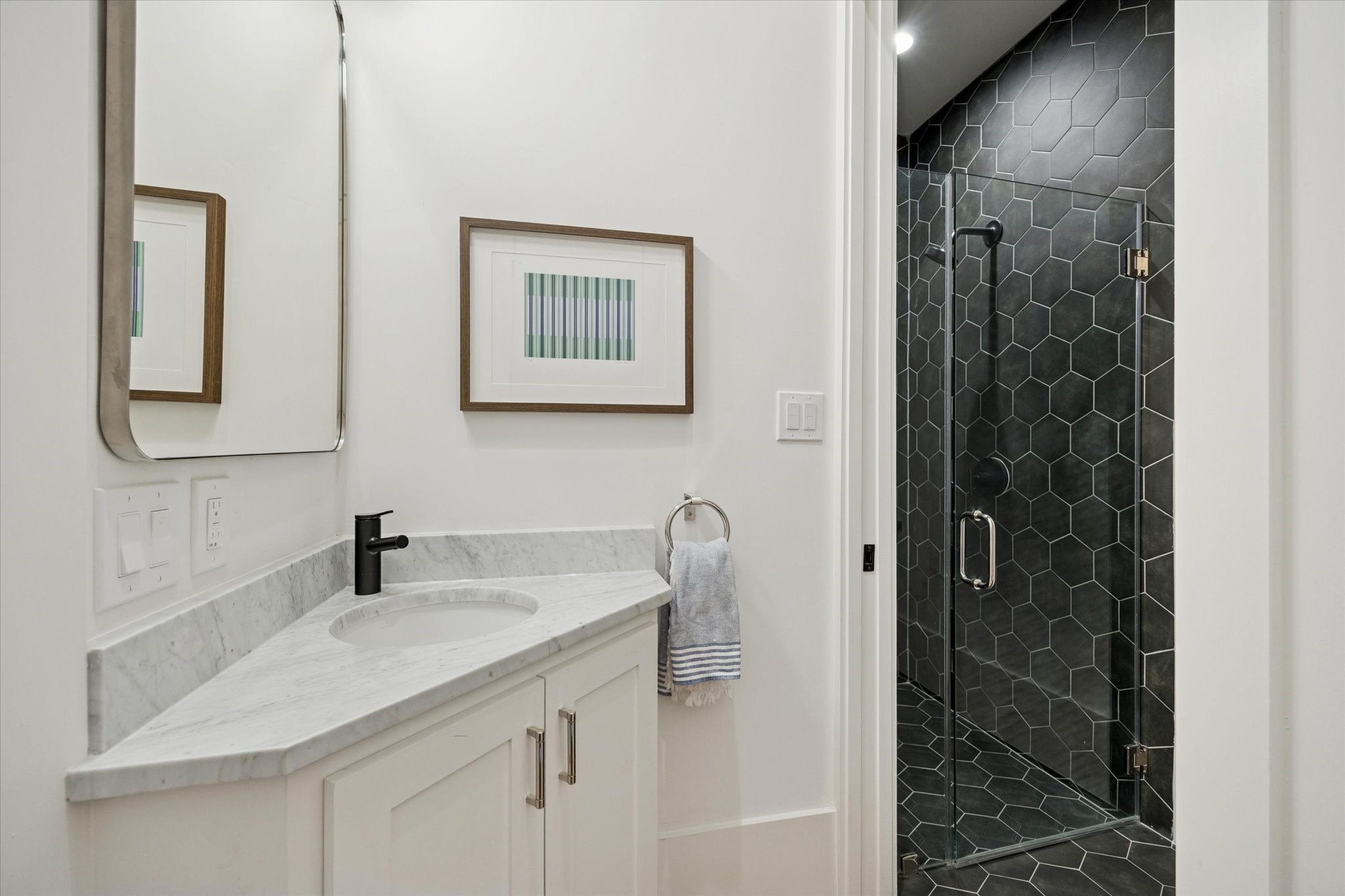 701 Ridge Street Houston, TX 77009 - Photo 7 of 50 a bathroom with a granite countertop sink a mirror and shower