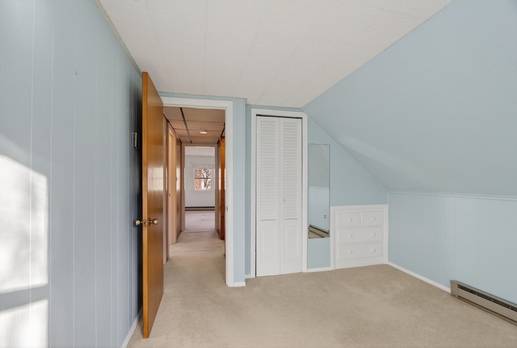 12 Patricia Road Peabody, MA 01960 - Photo 29 of 42 a view of a room with an empty space and a hallway