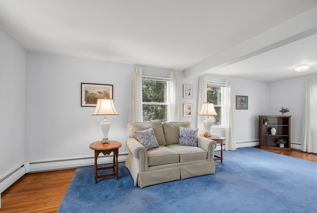 12 Patricia Road Peabody, MA 01960 - Photo 8 of 42 a living room with furniture and a wooden floor