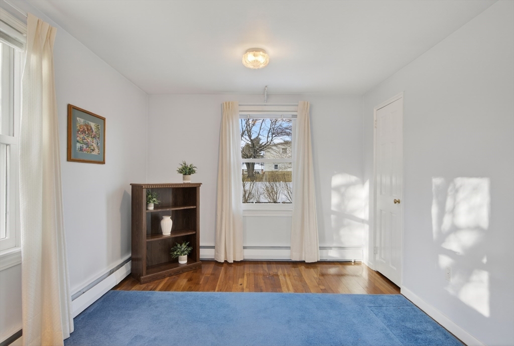 12 Patricia Road Peabody, MA 01960 - Photo 9 of 42 a view of a room with wooden floor and cabinet