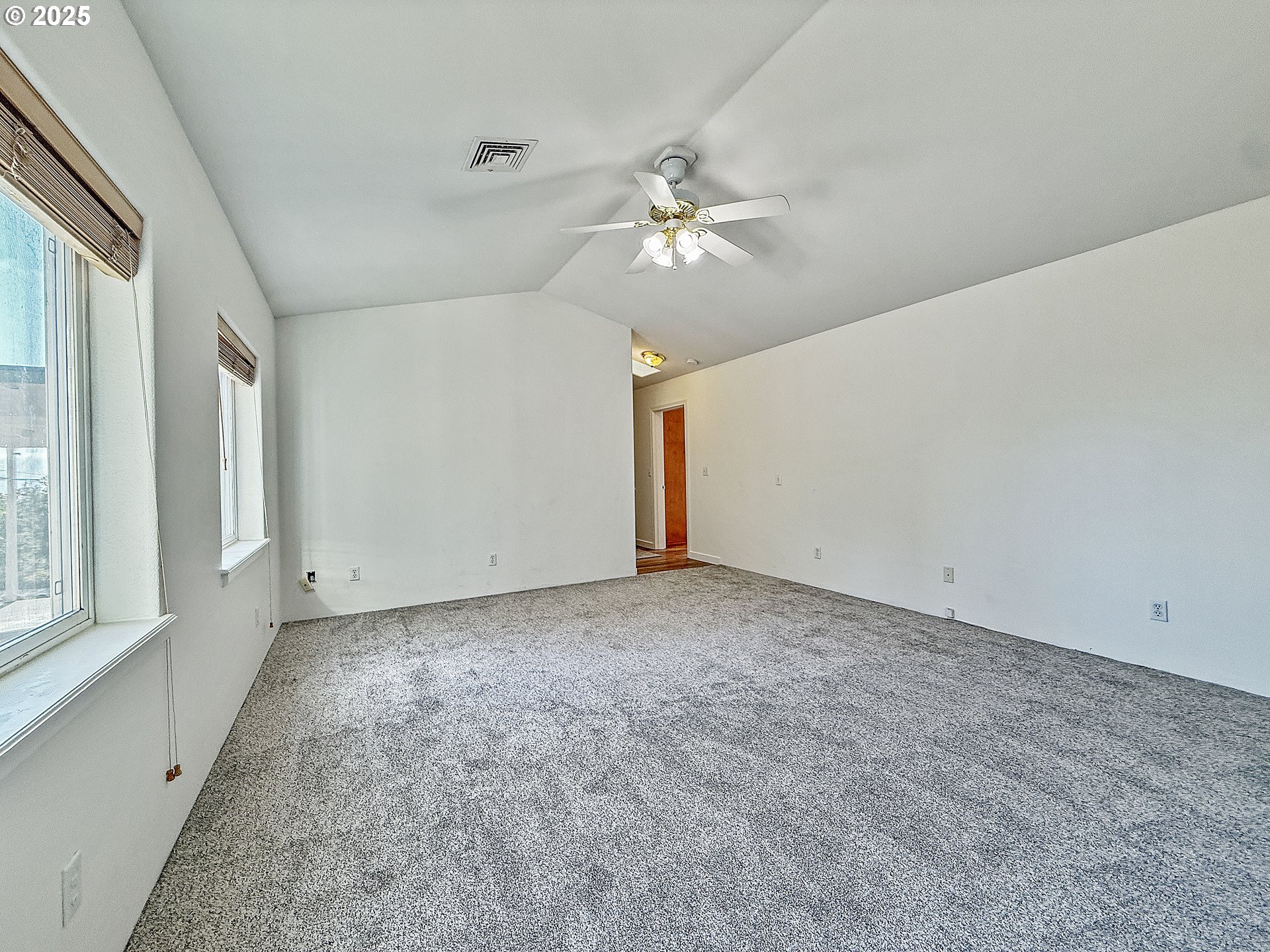 97923 Payne Road Brookings, OR 97415 - Photo 12 of 42 a view of a livingroom with a ceiling fan and window