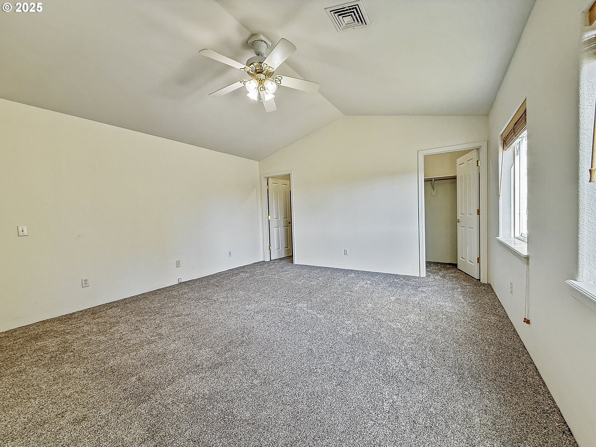 97923 Payne Road Brookings, OR 97415 - Photo 13 of 42 a view of an empty room with a chandelier fan