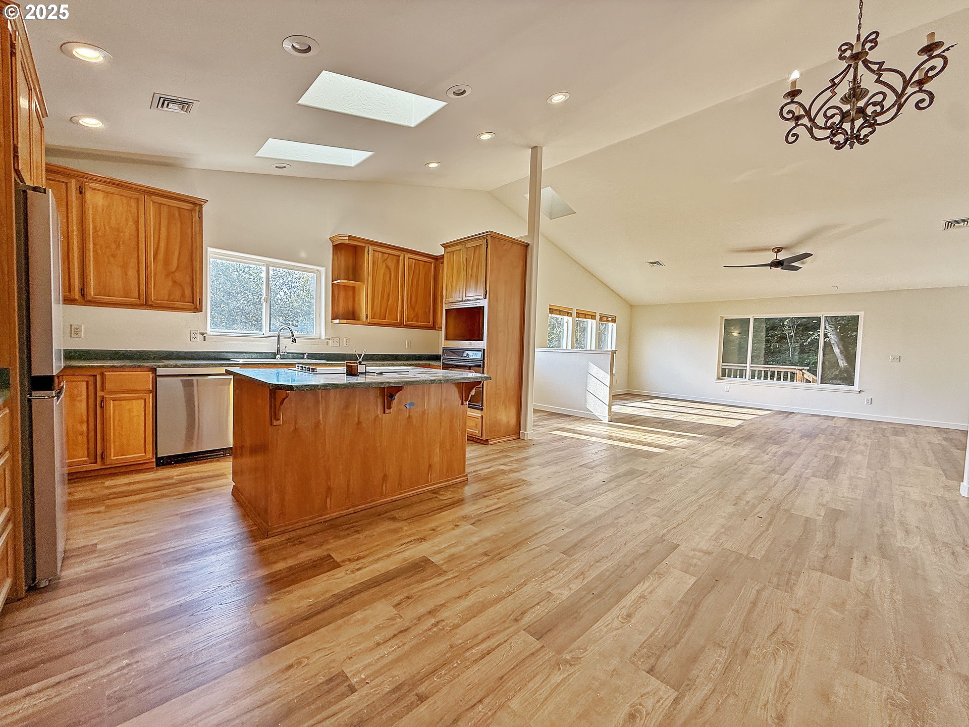 97923 Payne Road Brookings, OR 97415 - Photo 36 of 42 a large kitchen with stainless steel appliances granite countertop a stove and a wooden floors