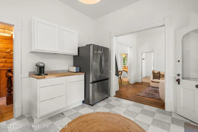 a kitchen with cabinets and window
