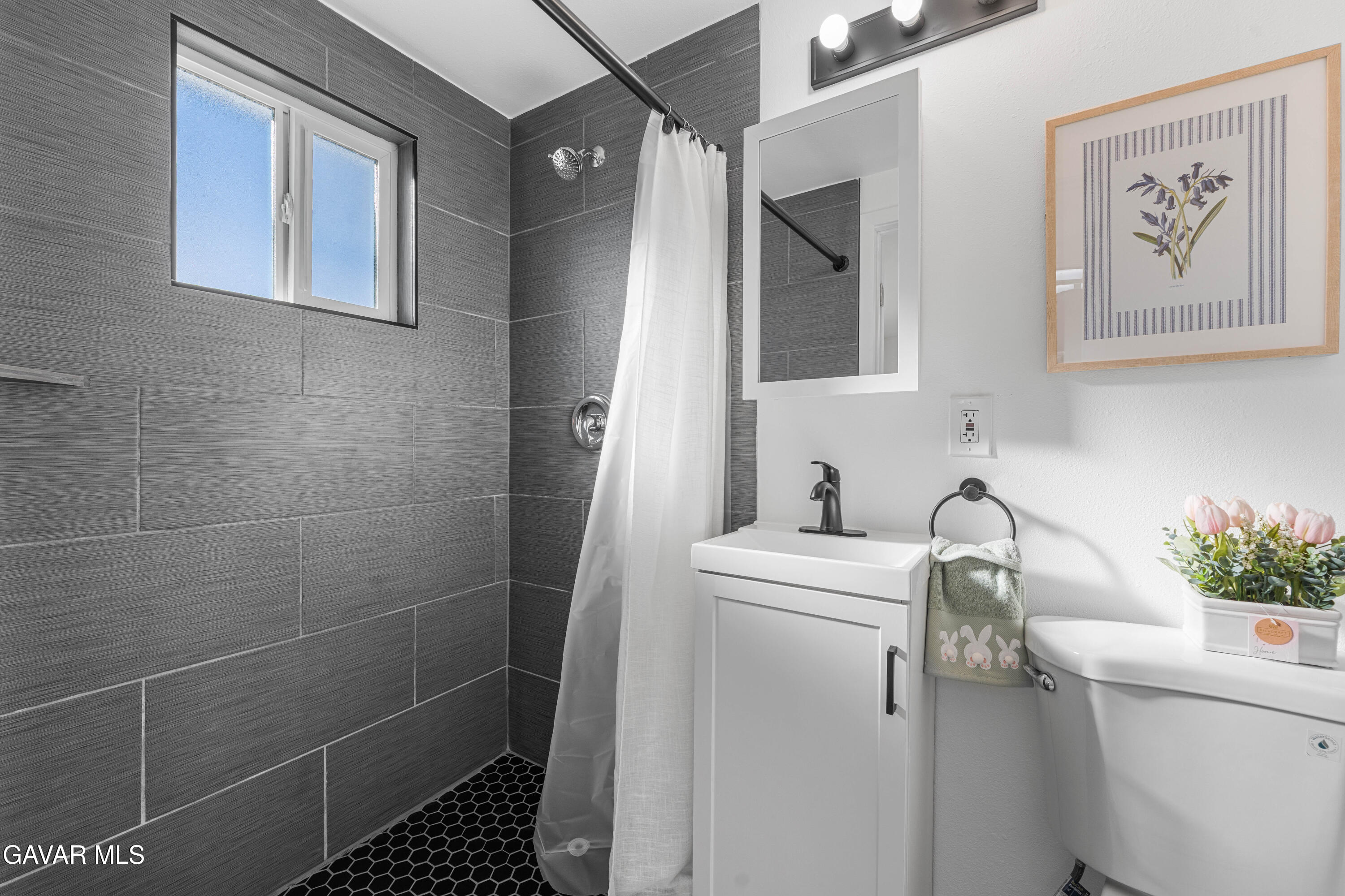 44745 3rd Street East Lancaster, CA 93535 - Photo 11 of 30 a bathroom with a sink a toilet and shower