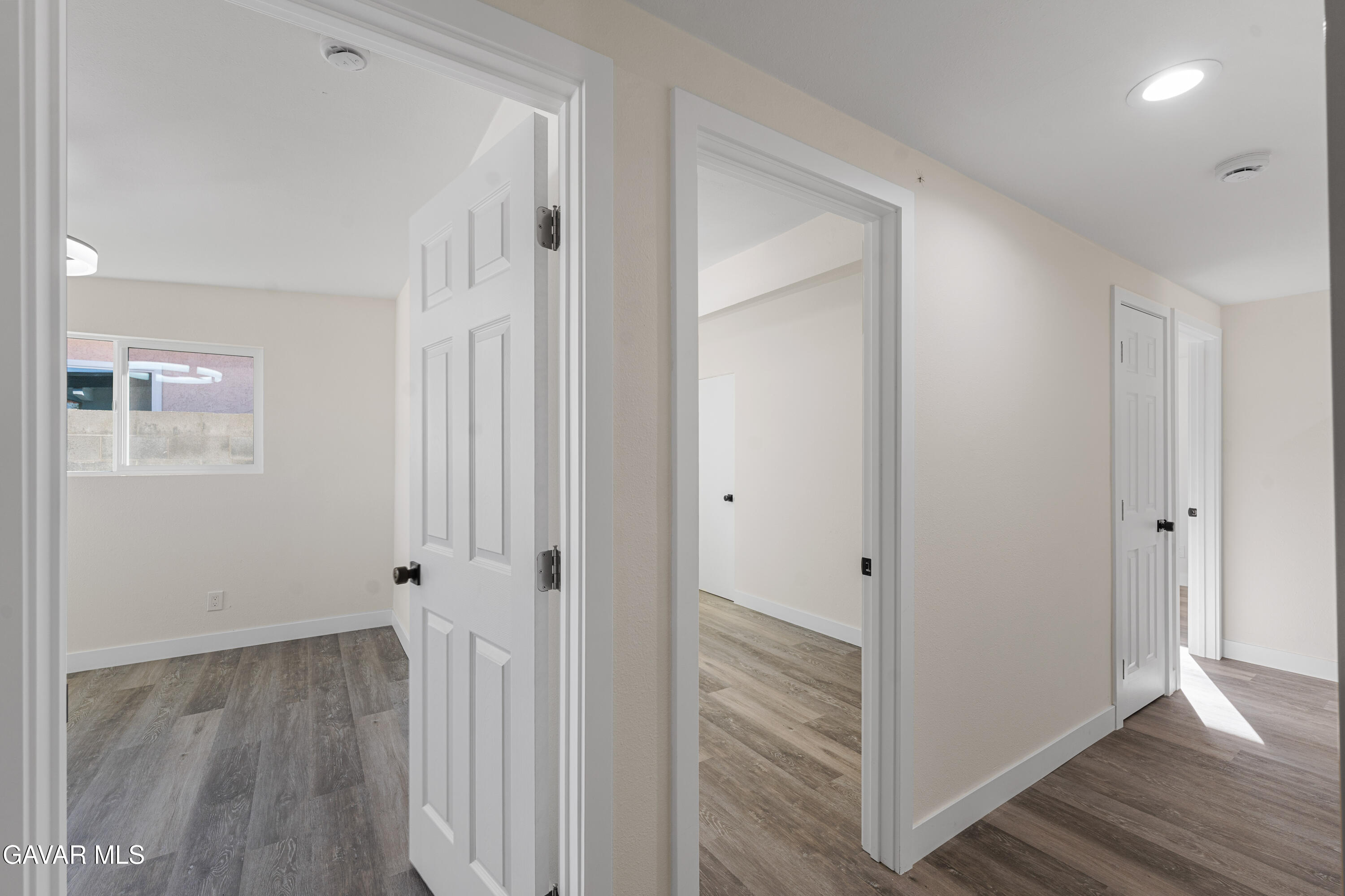 44745 3rd Street East Lancaster, CA 93535 - Photo 16 of 30 a view of a hallway with wooden floor