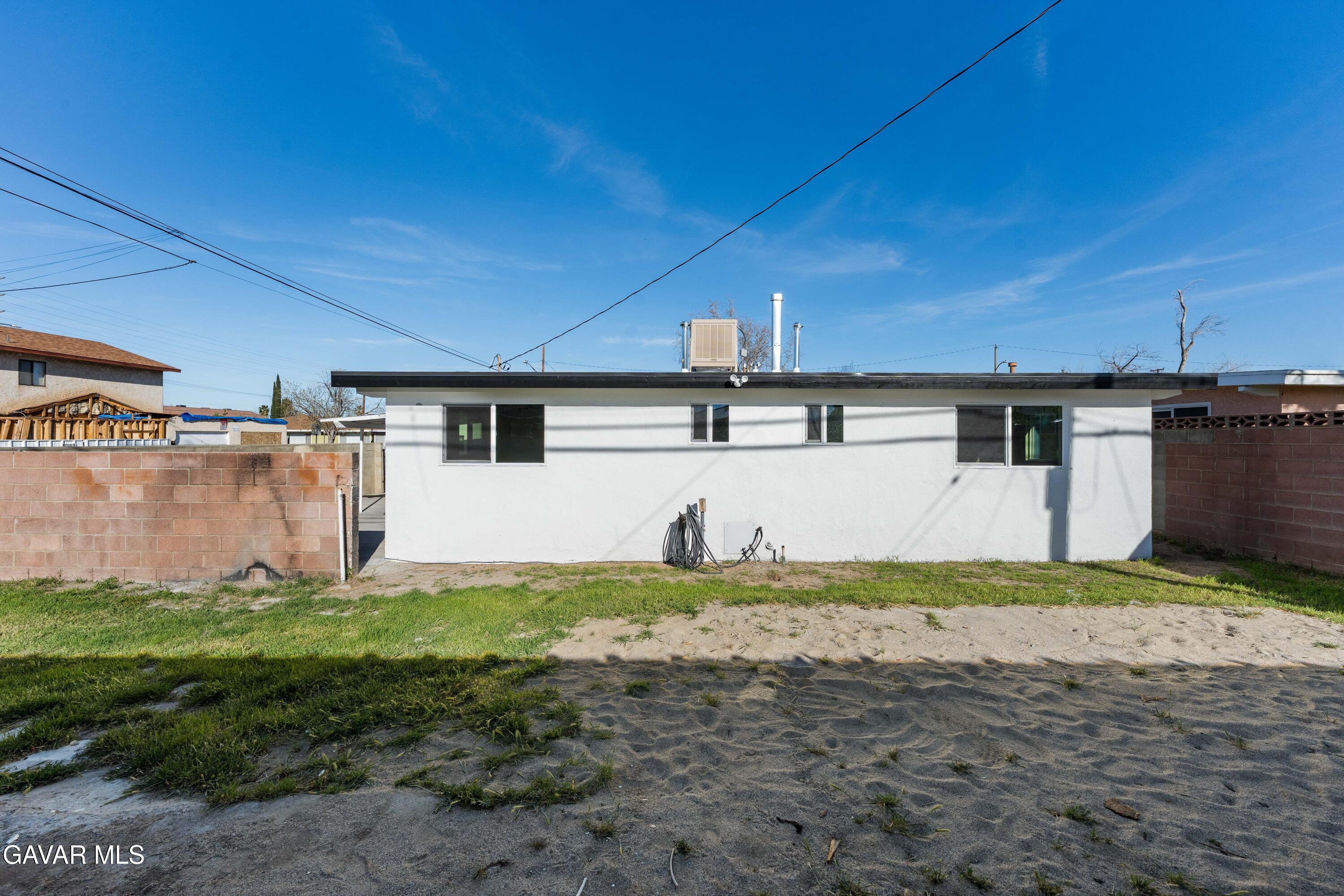 44745 3rd Street East Lancaster, CA 93535 - Photo 2 of 30 a view of a house with backyard and garden