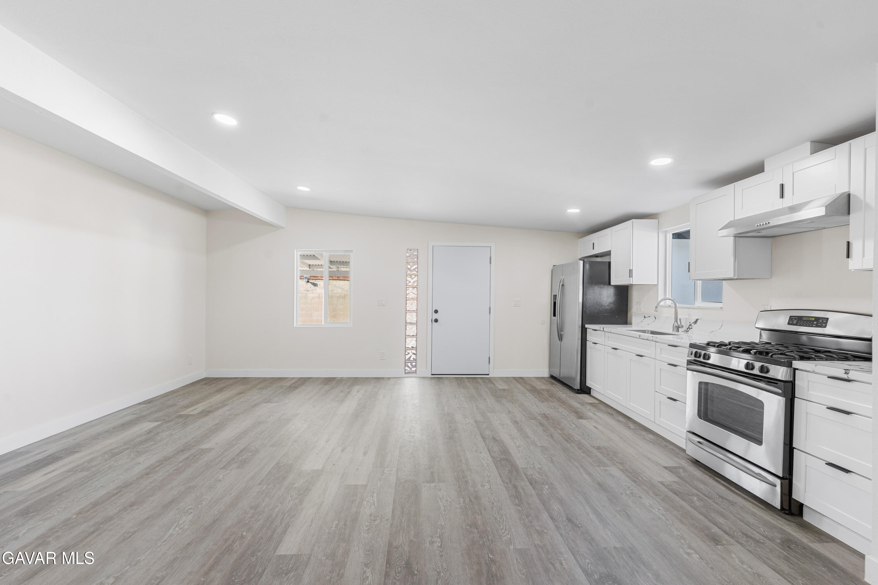 44745 3rd Street East Lancaster, CA 93535 - Photo 26 of 30 a view of kitchen with wooden floor and electronic appliances
