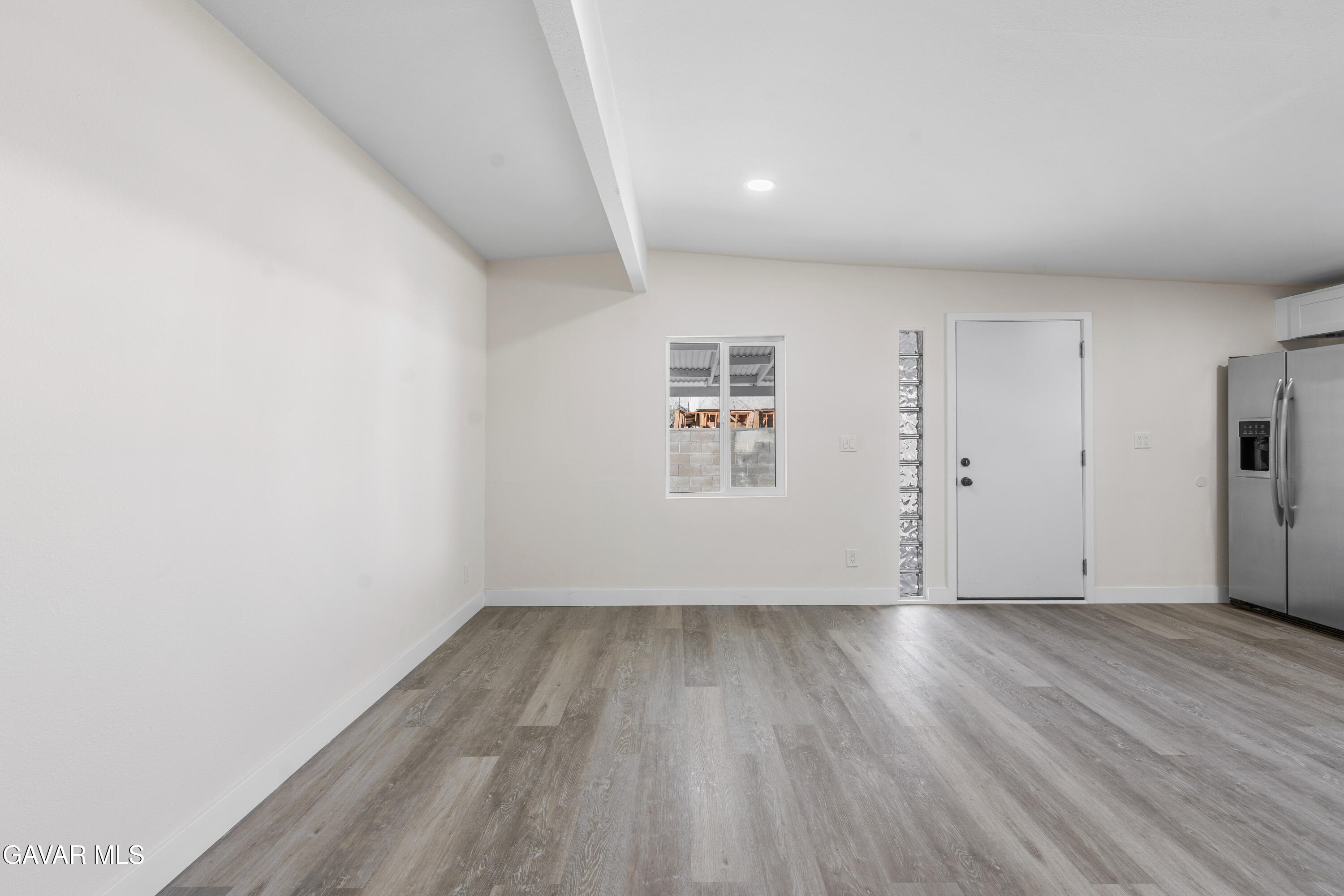 44745 3rd Street East Lancaster, CA 93535 - Photo 28 of 30 a view of an empty room with wooden floor
