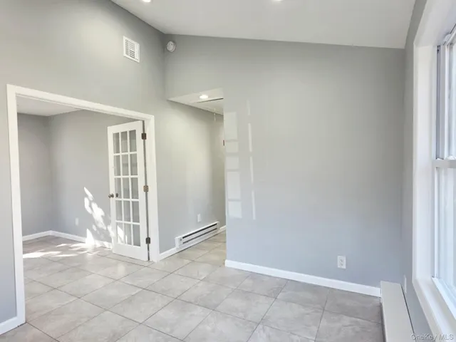 a view of entryway with bathroom