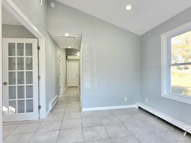 a view of an empty room with a window