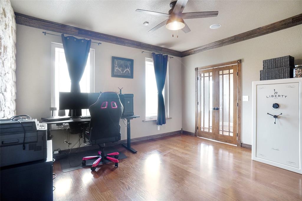 13340 John Day Road Haslet, TX 76052 - Photo 13 of 30 a workspace with wooden floor windows cabinet and wooden floor