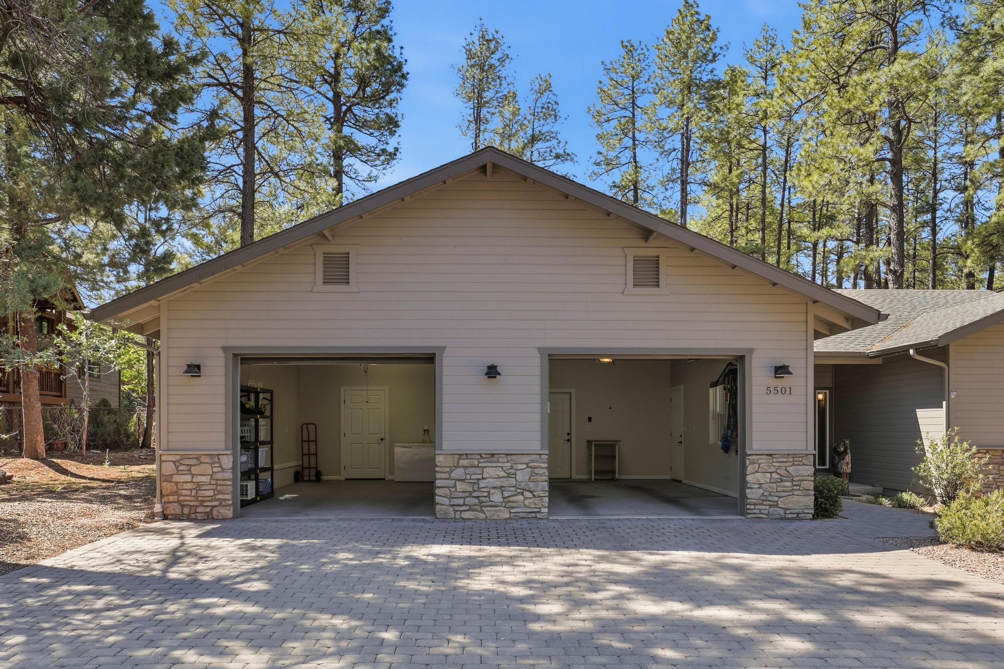 5501 Solitude Trail Loop Pine, AZ 85544 - Photo 3 of 27 a view of a house with a yard and large tree