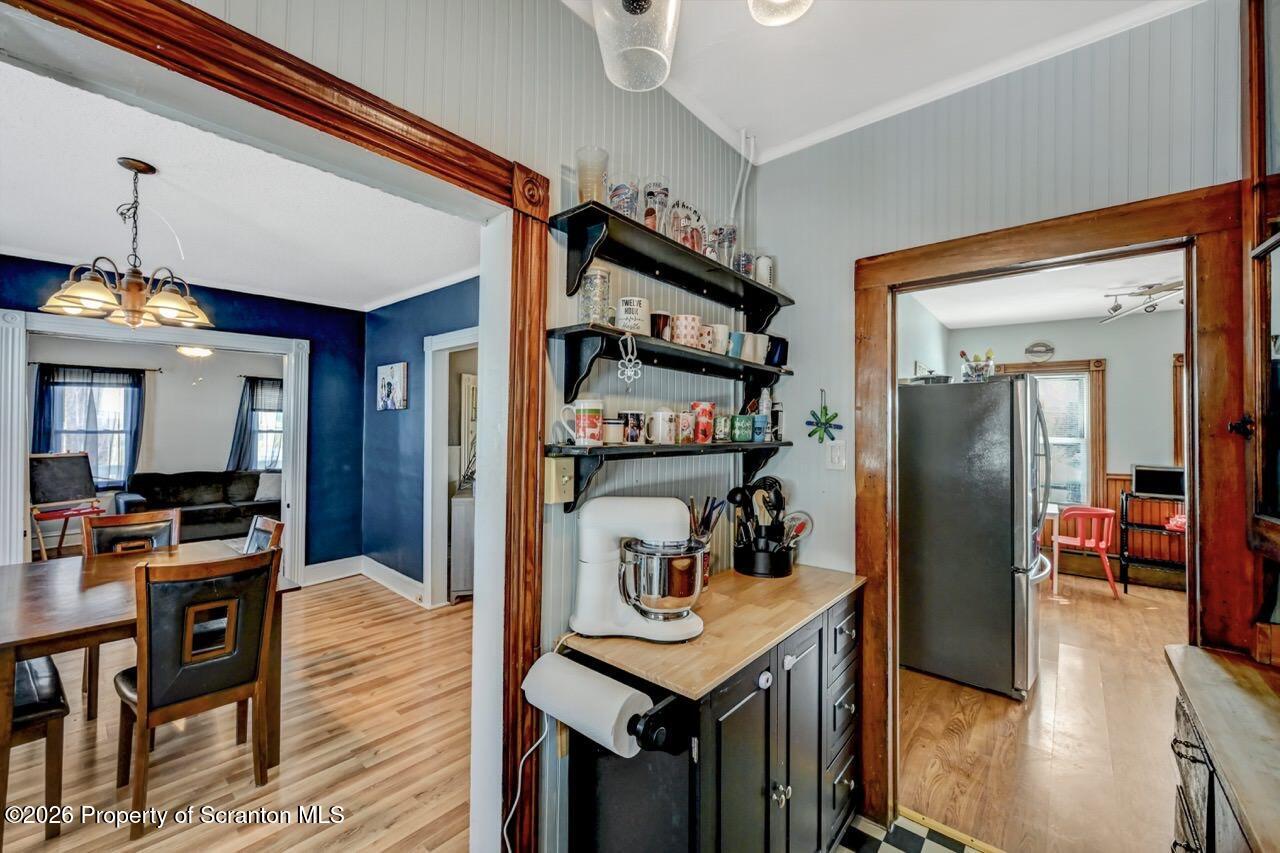 117 West Line Street Olyphant, PA 18447 - Photo 11 of 47 a view of a hallway with wooden floor and workspace