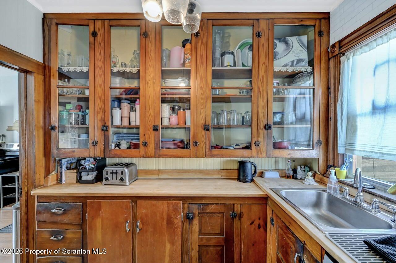 117 West Line Street Olyphant, PA 18447 - Photo 13 of 47 a kitchen with stainless steel appliances a sink and cabinets