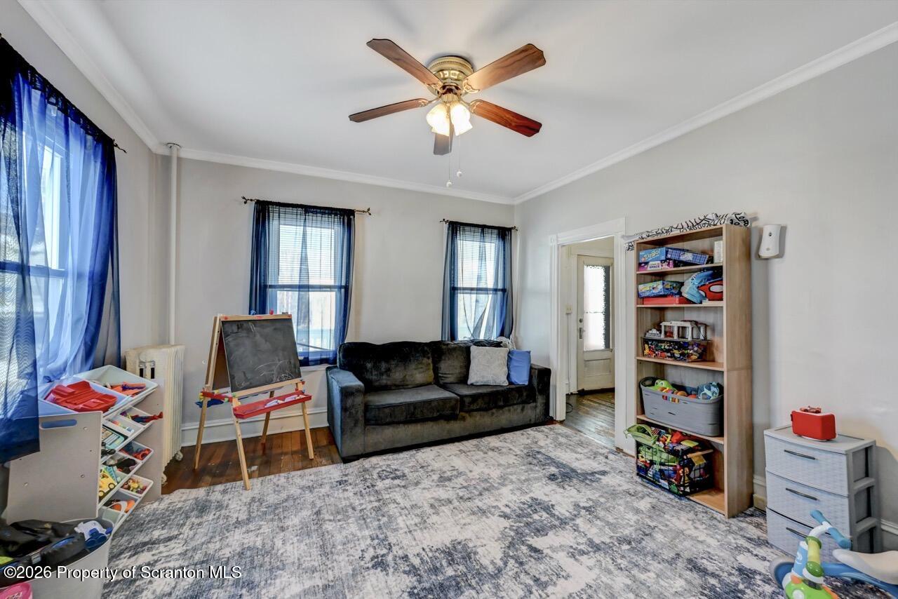 117 West Line Street Olyphant, PA 18447 - Photo 23 of 47 a living room with furniture and a flat screen tv