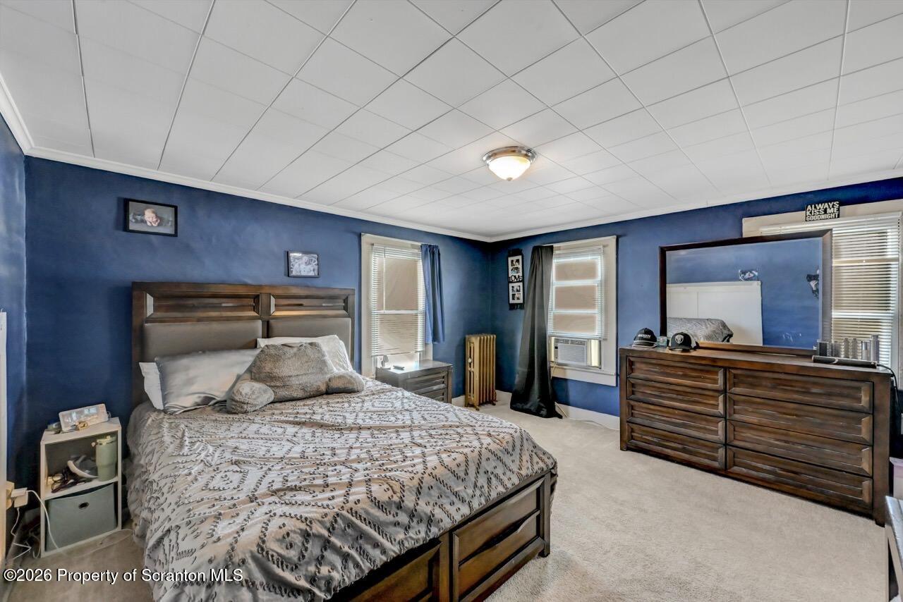 117 West Line Street Olyphant, PA 18447 - Photo 27 of 47 a bedroom with a large bed and furniture