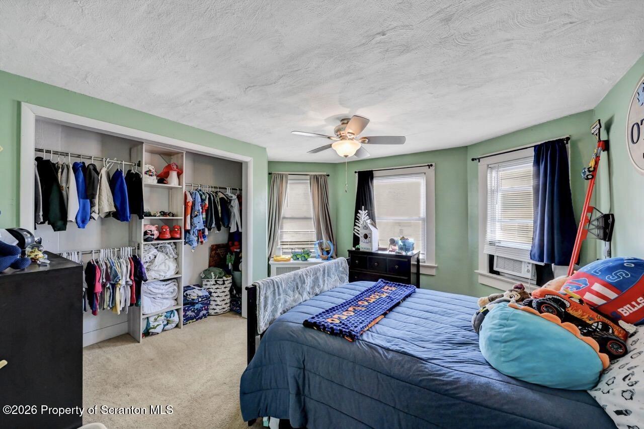 117 West Line Street Olyphant, PA 18447 - Photo 35 of 47 a bed room with a bed window and a television