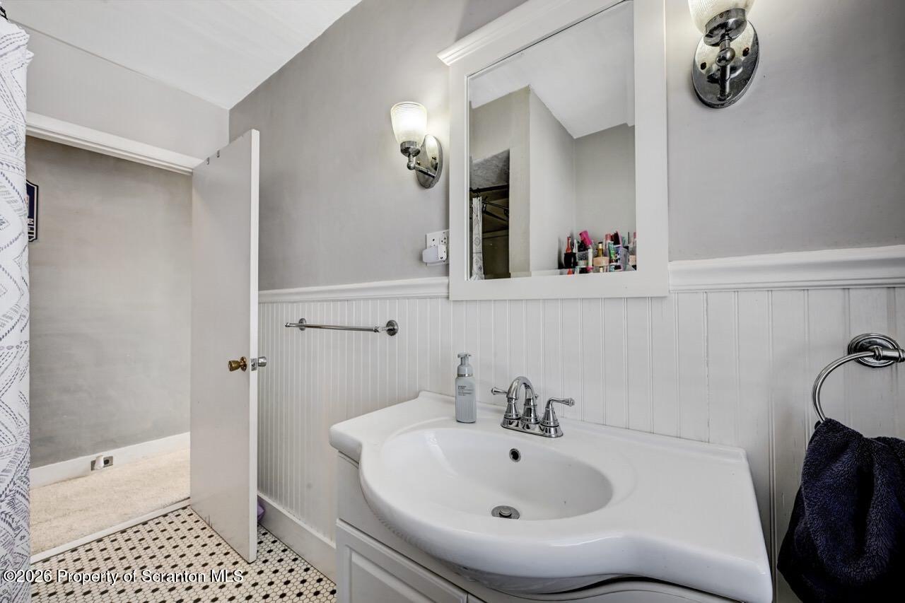 117 West Line Street Olyphant, PA 18447 - Photo 38 of 47 a bathroom with a sink and a mirror