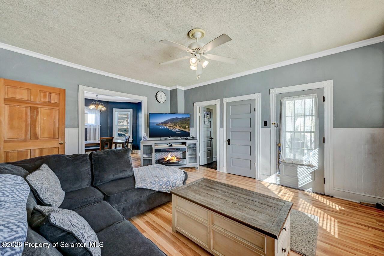 117 West Line Street Olyphant, PA 18447 - Photo 5 of 47 a living room with furniture fireplace and a window