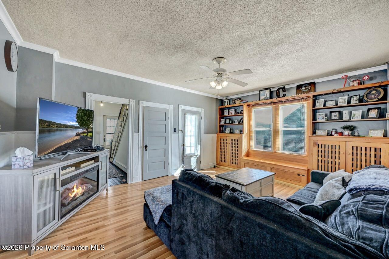 117 West Line Street Olyphant, PA 18447 - Photo 6 of 47 a living room with furniture and a flat screen tv