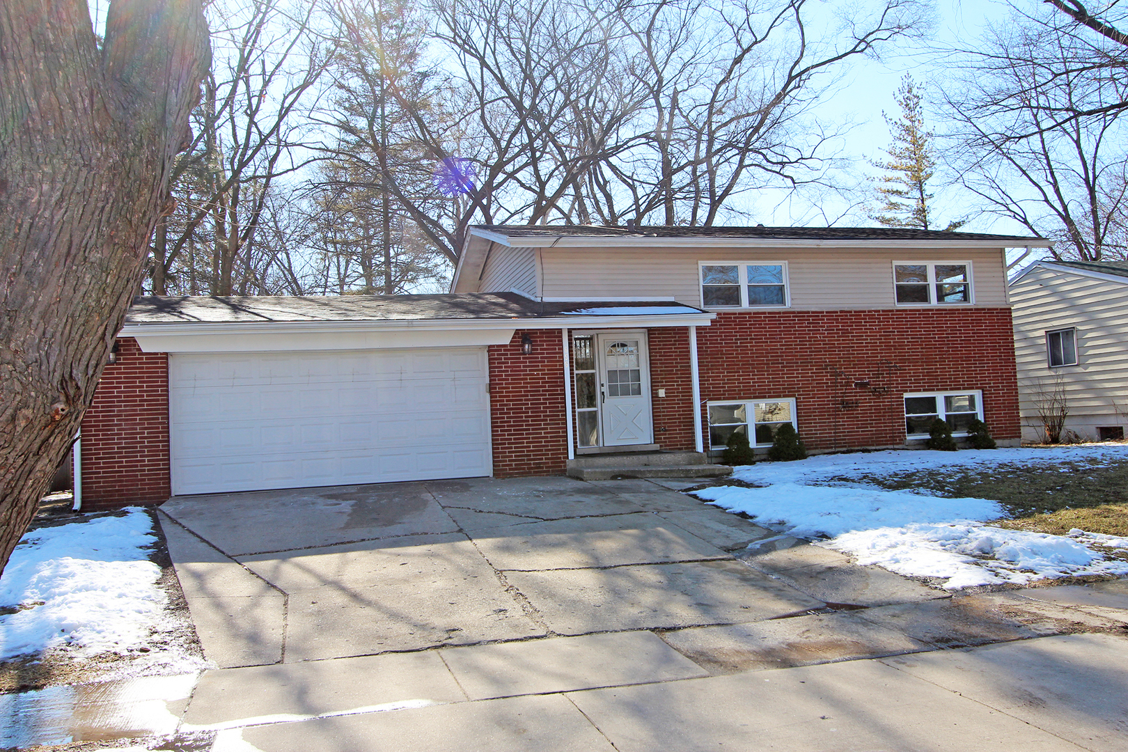 656 Briar Road Wauconda, IL 60084 - Photo 1 of 25 a front view of a house with a yard and garage