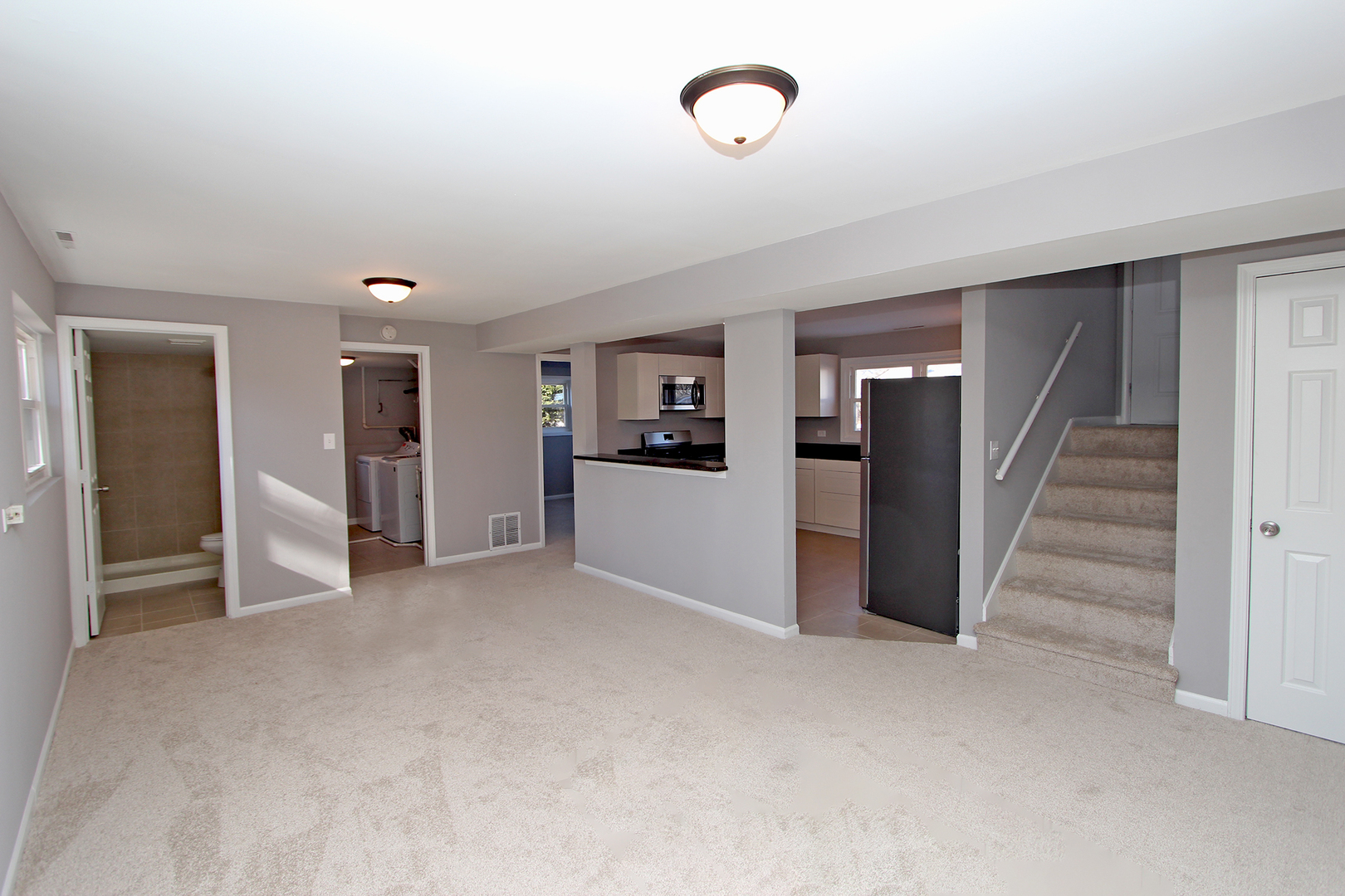 656 Briar Road Wauconda, IL 60084 - Photo 3 of 25 an empty room with kitchen and windows
