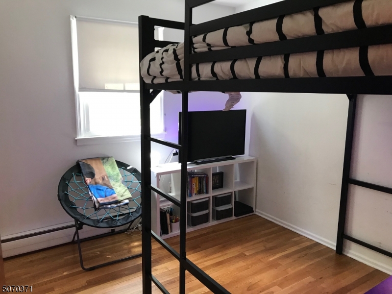 18 Parrott Mill Road Chatham, NJ 07928 - Photo 15 of 19 a living room with furniture and a flat screen tv