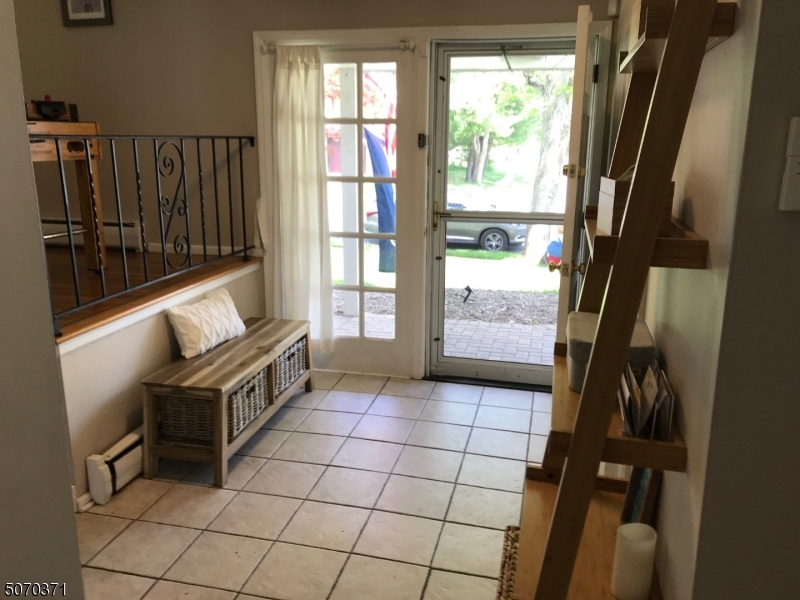 18 Parrott Mill Road Chatham, NJ 07928 - Photo 2 of 19 a view of an entryway with wooden floor and windows