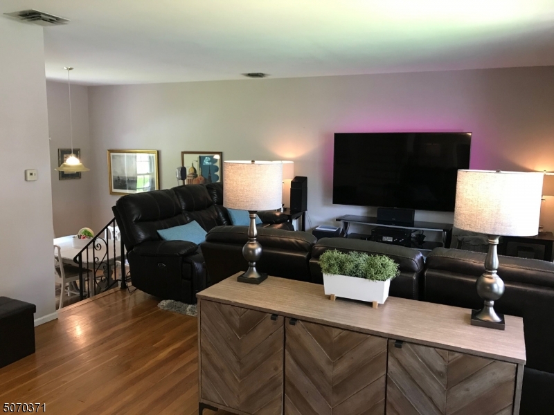 18 Parrott Mill Road Chatham, NJ 07928 - Photo 5 of 19 a living room with furniture and a flat screen tv