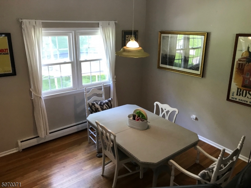 18 Parrott Mill Road Chatham, NJ 07928 - Photo 6 of 19 a view of a dining room with furniture and wooden floor
