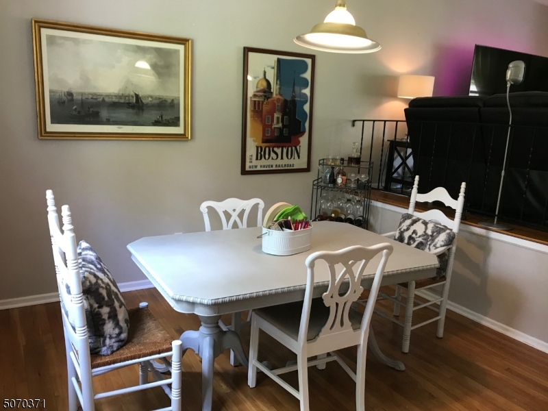 18 Parrott Mill Road Chatham, NJ 07928 - Photo 7 of 19 a view of a dining room with furniture and wooden floor